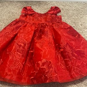 Red beautiful dress. The shoulders have a bow on each side